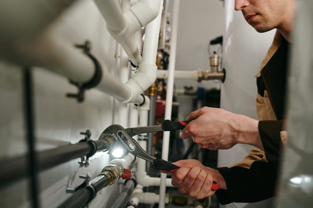 Plumbers maintaining commercial plumbing pipes in Fleming Island